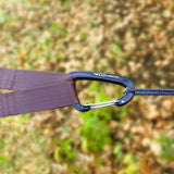 black dd hammocks karabiner clipped to tree huggers