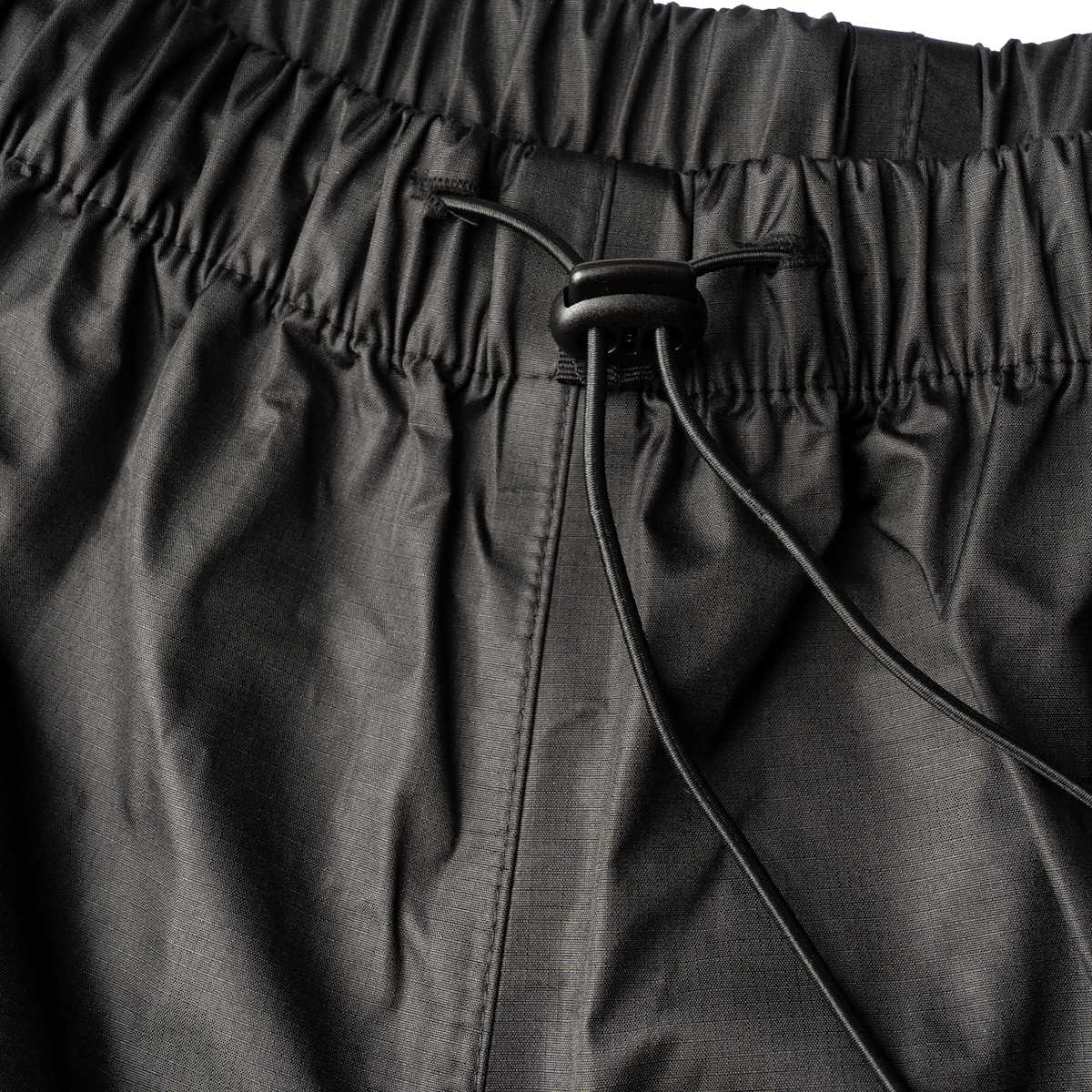 elasticated waist and toggle on highlander typhoon waterproof black trousers